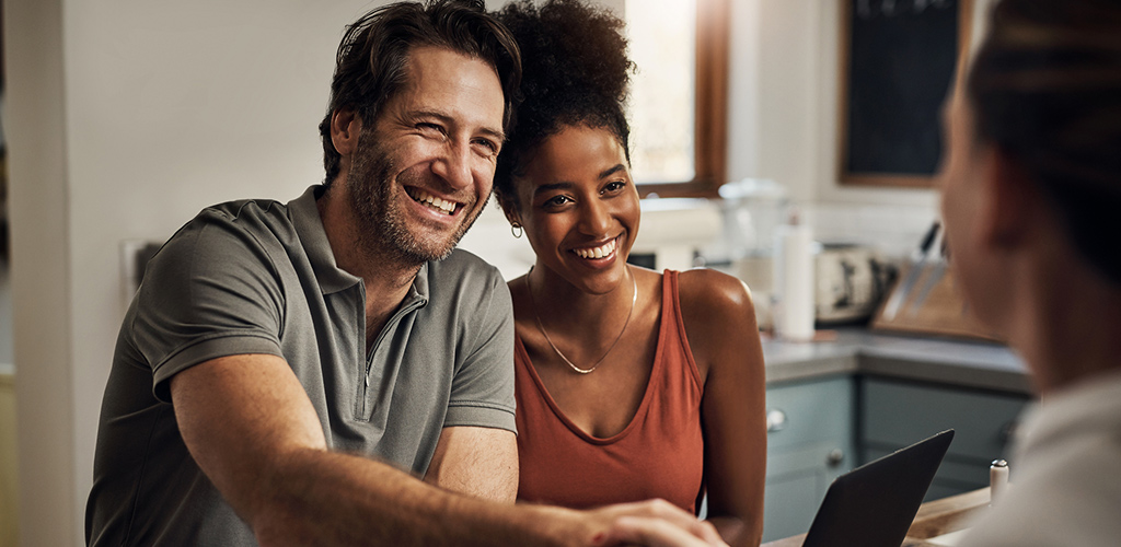 Couple smiling during a financial consultation